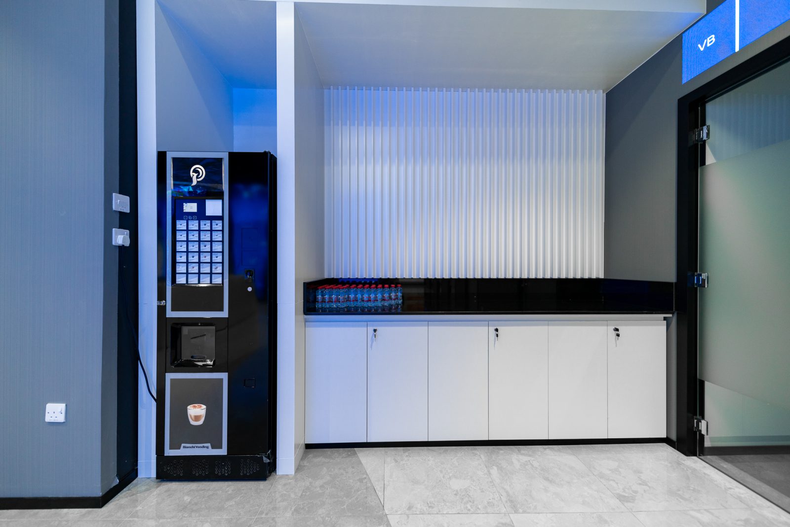 Wide step-free hallway connecting service counters to private legal cabins