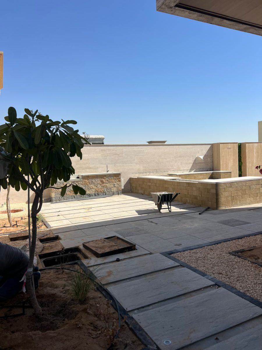 Private villa garden landscaping with integrated perimeter illumination and sunken planters